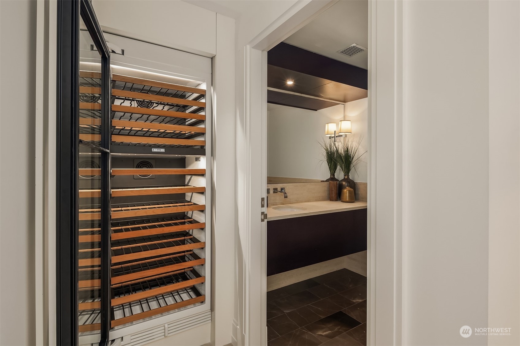 99 Union Street, Unit 1104 Seattle, WA 98101 - Photo 29 of 38 a view of bathroom with a sink and mirror