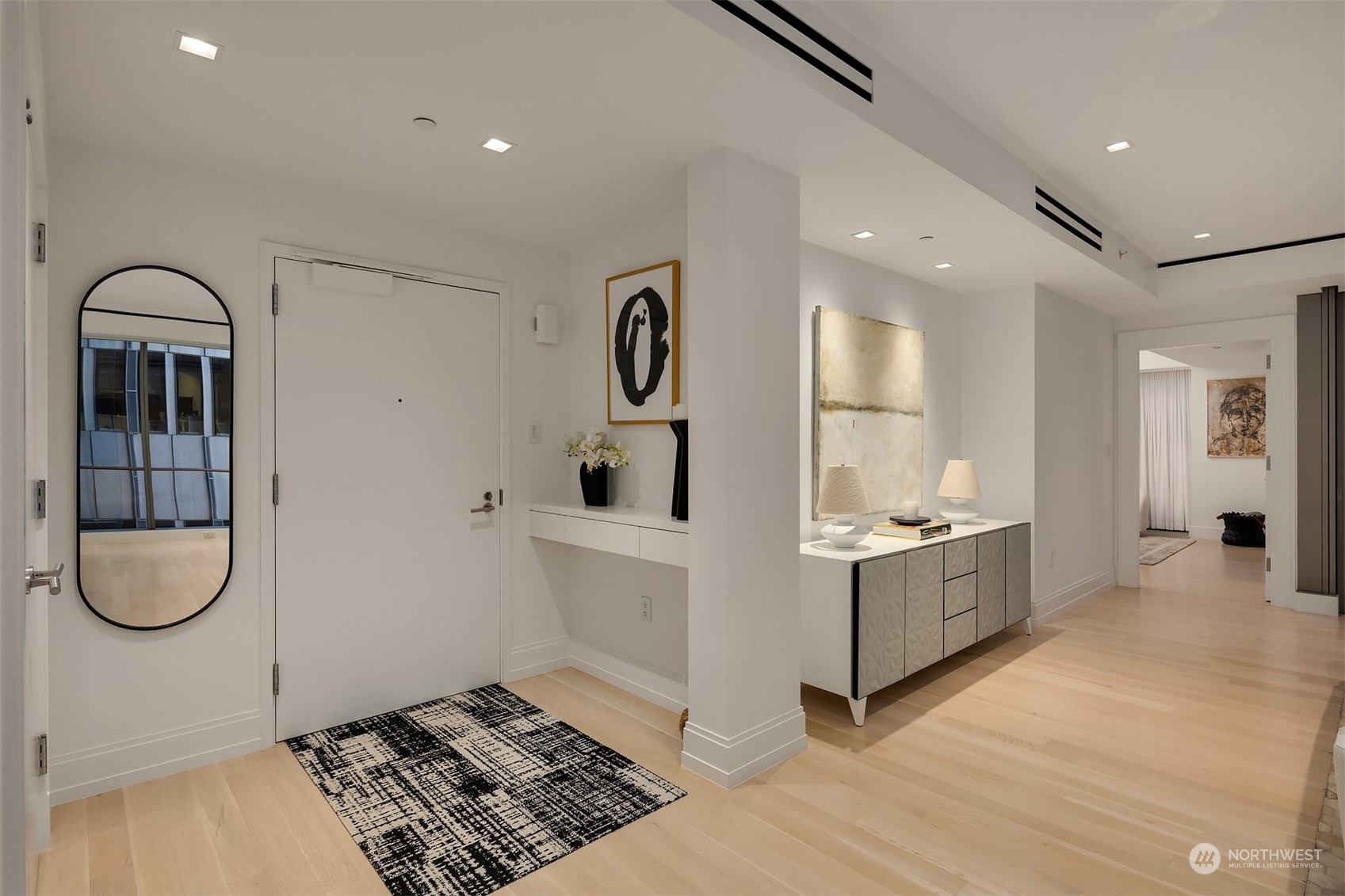 99 Union Street, Unit 1104 Seattle, WA 98101 - Photo 5 of 38 a kitchen with granite countertop a white stove top oven and sink