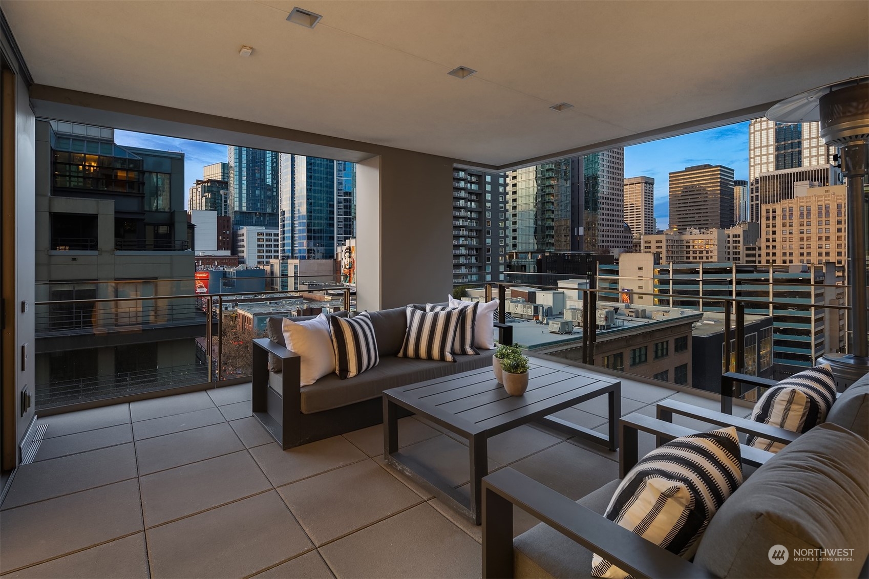 99 Union Street, Unit 1104 Seattle, WA 98101 - Photo 6 of 38 a living room with furniture and a floor to ceiling window