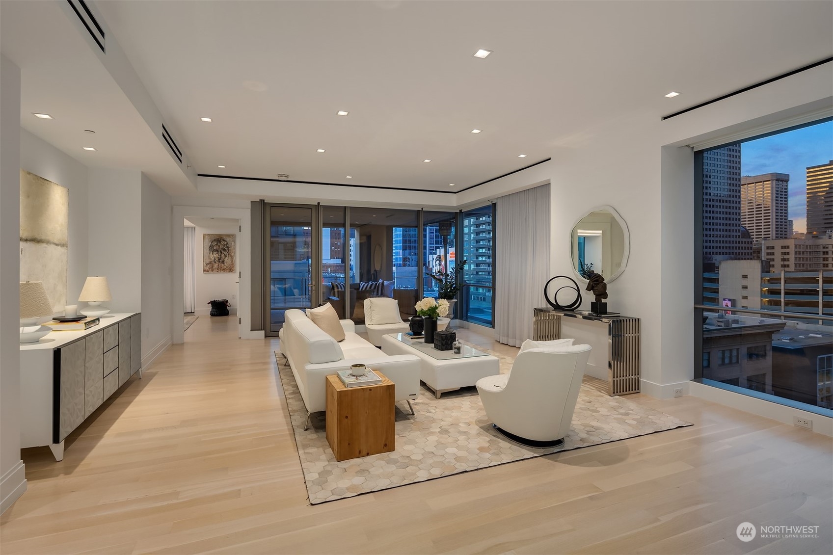 99 Union Street, Unit 1104 Seattle, WA 98101 - Photo 9 of 38 a living room with furniture a large window and wooden floor