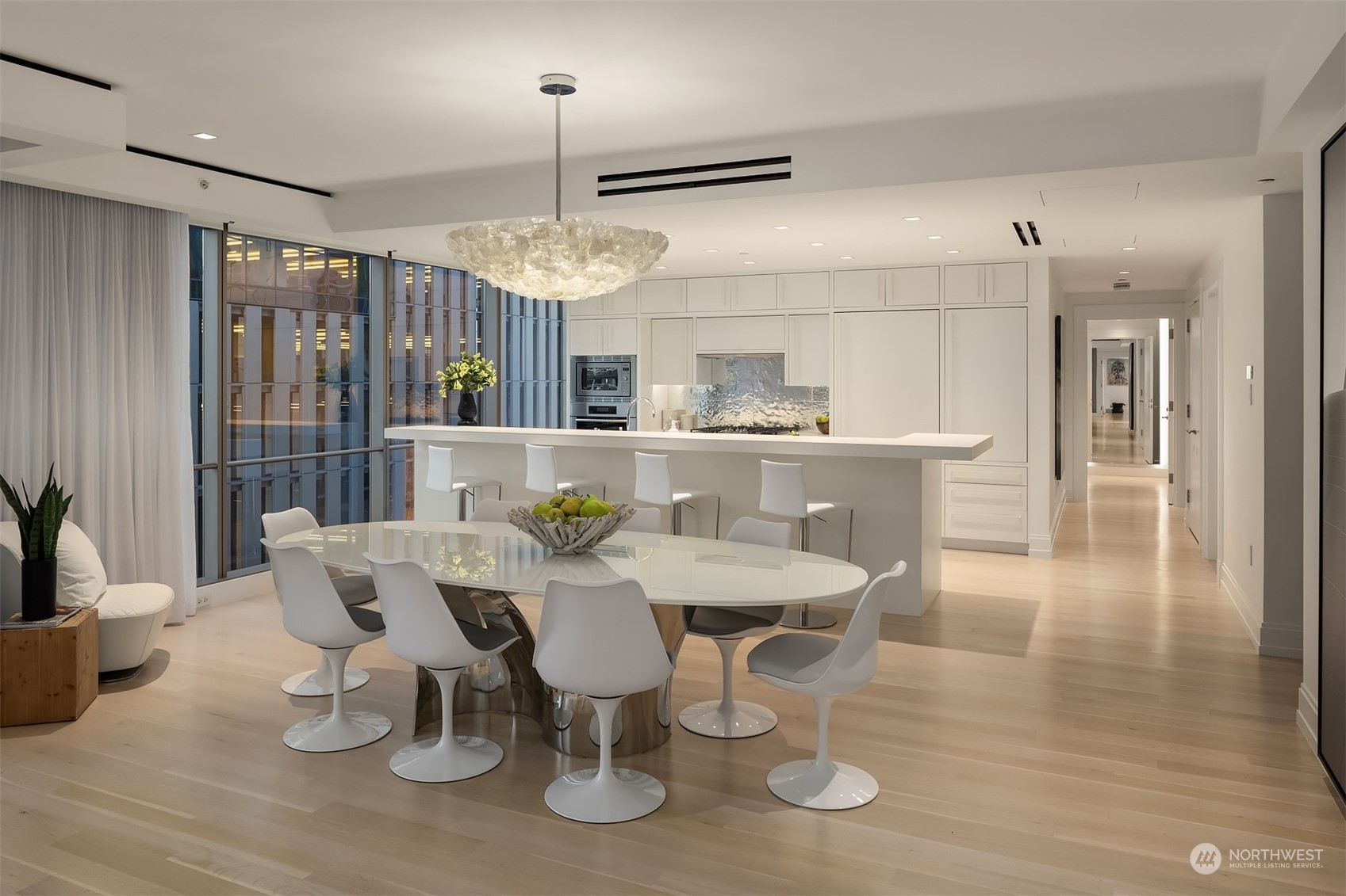 99 Union Street, Unit 1104 Seattle, WA 98101 - Photo 10 of 38 a view of a dining room with furniture window and wooden floor