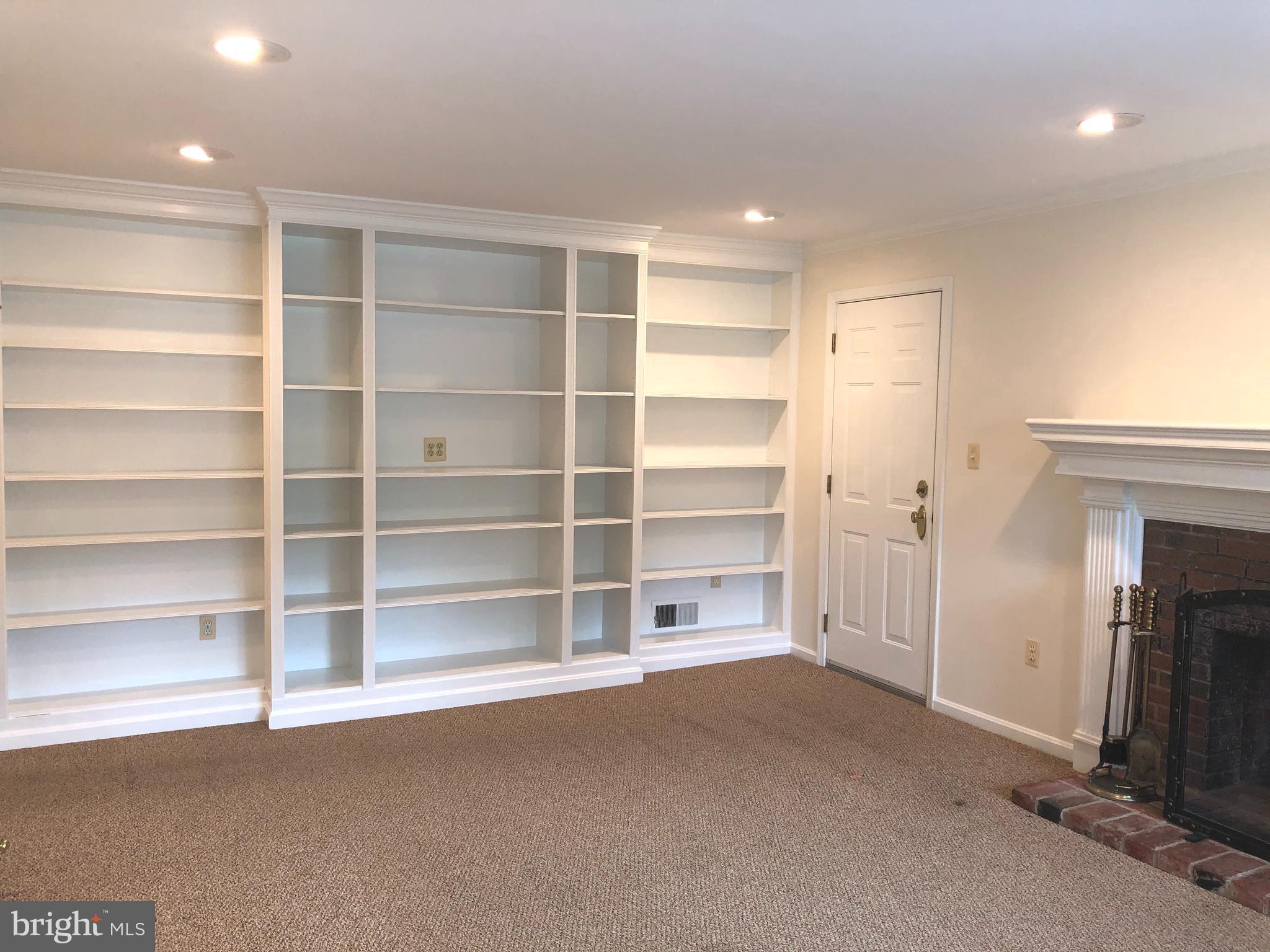 7327 Yates Court McLean, VA 22101 - Photo 11 of 34 Family Room with built-in shelving and fireplace