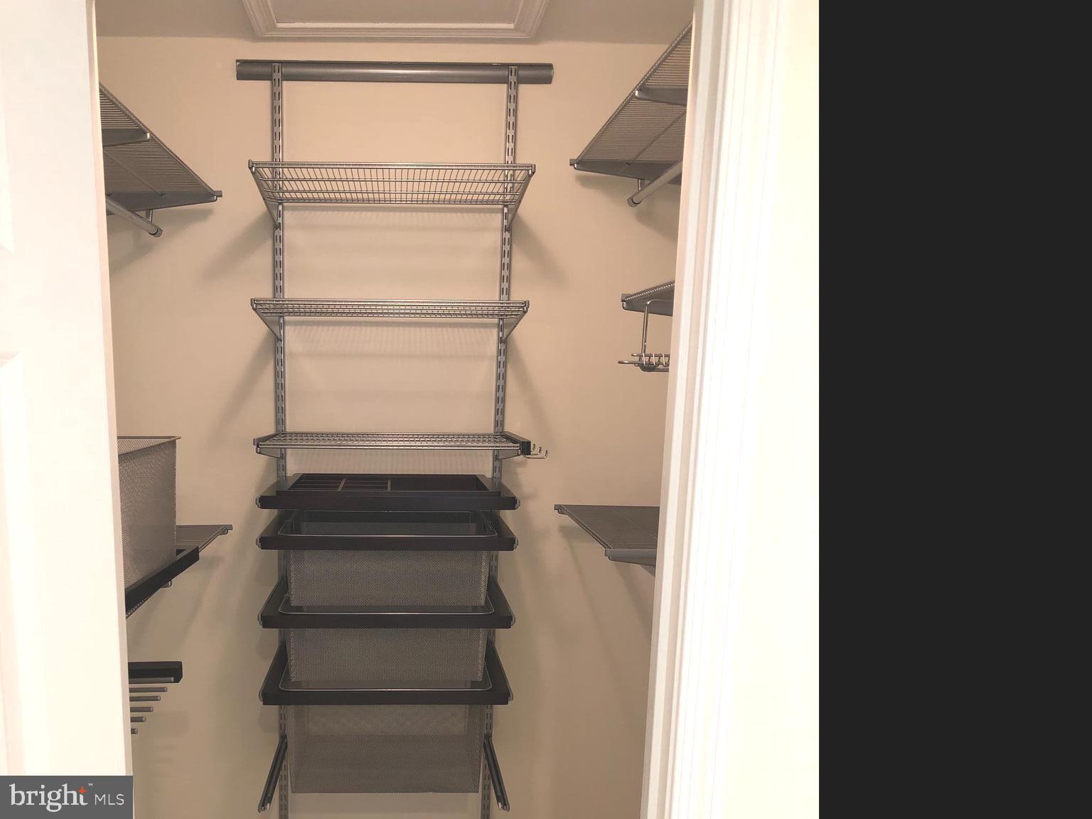 7327 Yates Court McLean, VA 22101 - Photo 19 of 34 Master Bedroom walk-in closet with custom shelving