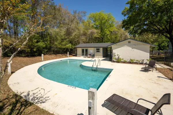 a view of a swimming pool with a patio