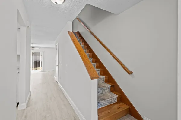 a view of a hallway with staircase