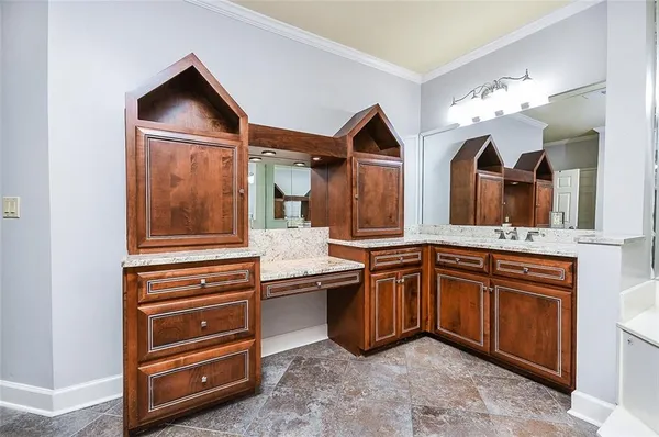 a kitchen with a sink and cabinets
