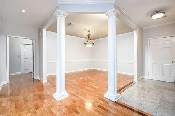 wooden floor in a hall with an entryway