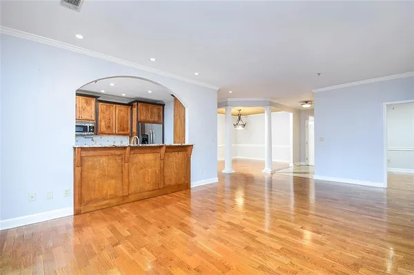 a view of a kitchen with a sink and a window
