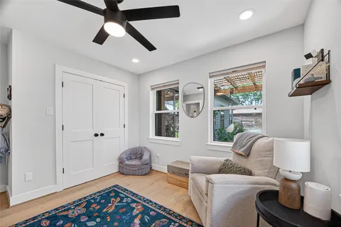 a bedroom with furniture and a window