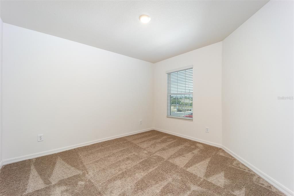 691 Poppy Lane Dundee, FL 33838 - Photo 13 of 16 an empty room with a window