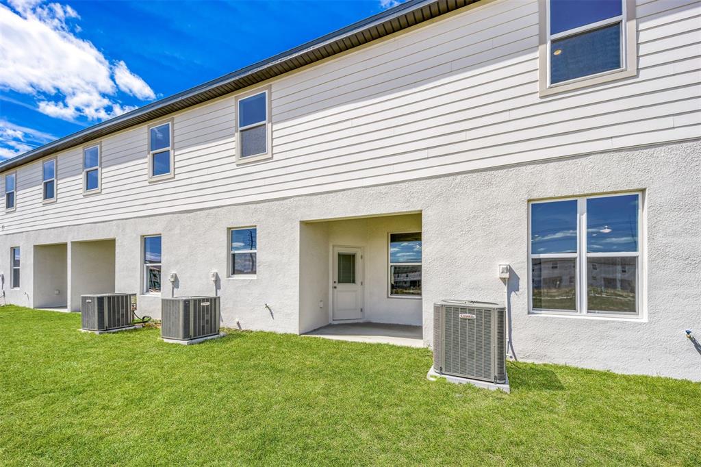 691 Poppy Lane Dundee, FL 33838 - Photo 16 of 16 a view of a house with backyard