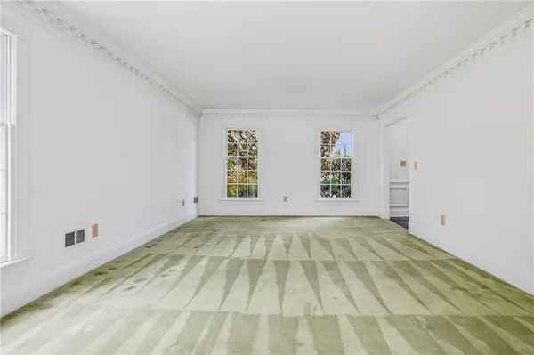 a view of an empty room and window