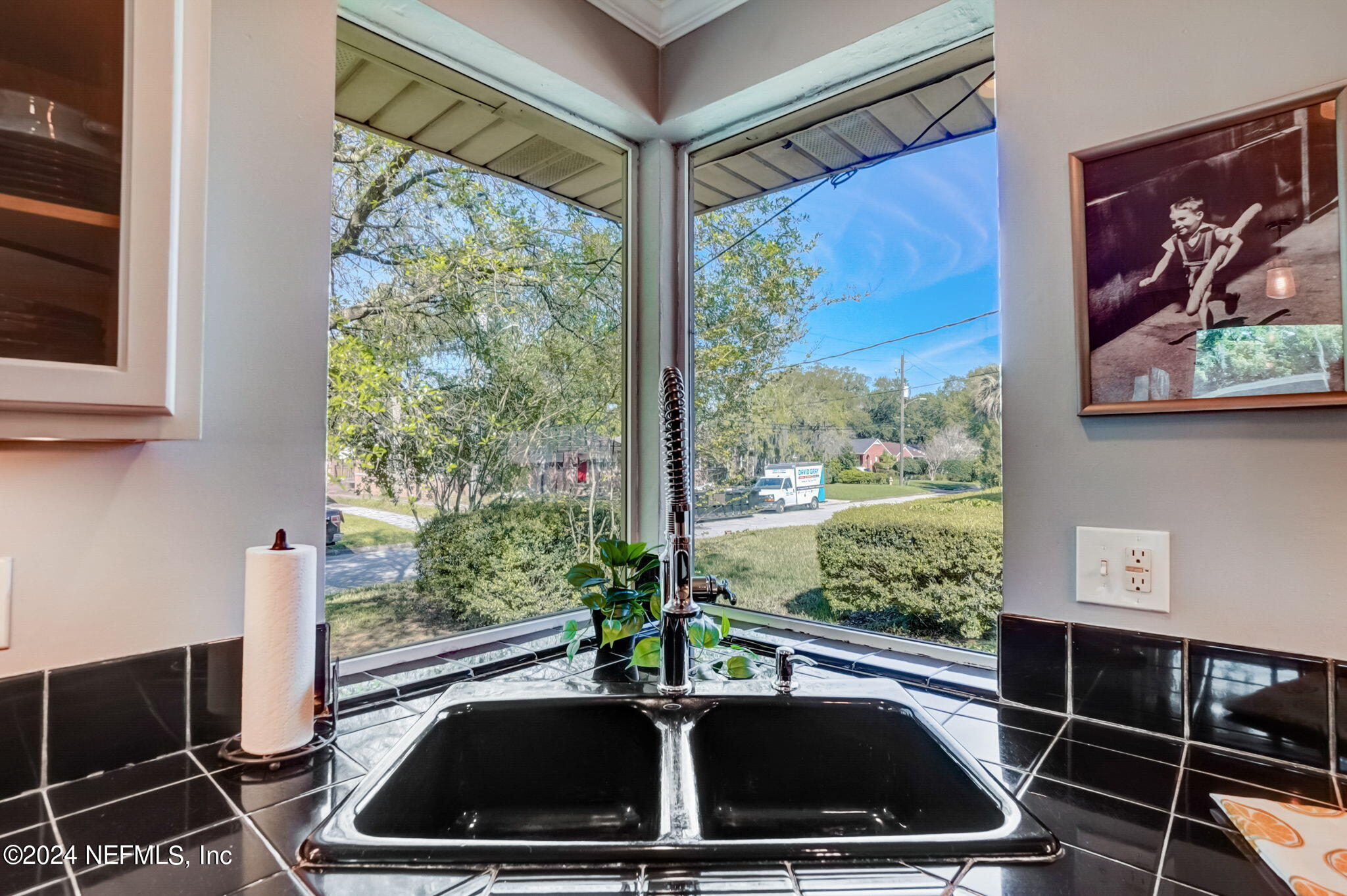 1435 Monticello Road Jacksonville, FL 32207 - Photo 11 of 33 a kitchen with a sink and wooden floor