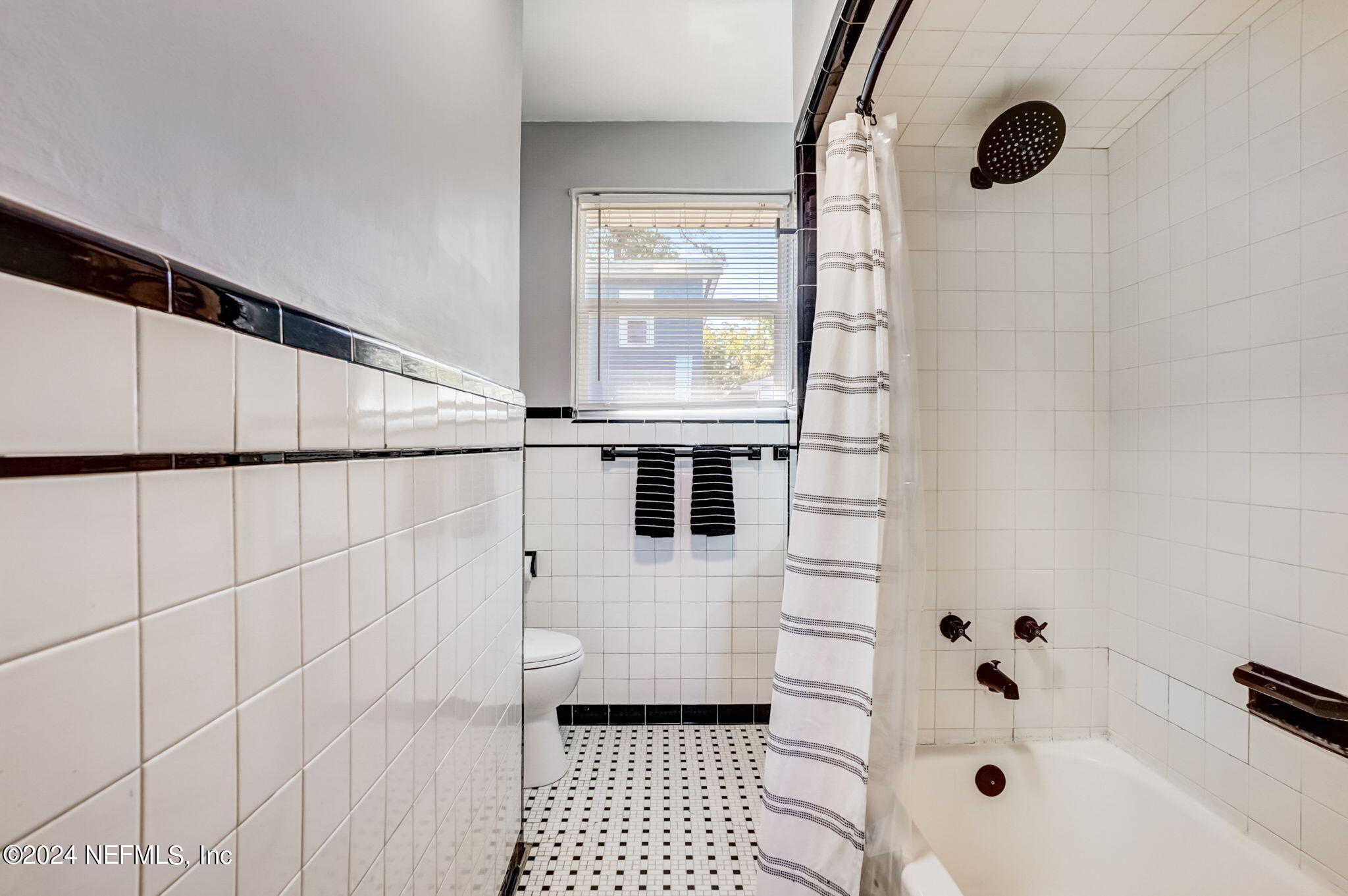 1435 Monticello Road Jacksonville, FL 32207 - Photo 21 of 33 a bathroom with a sink toilet and shower