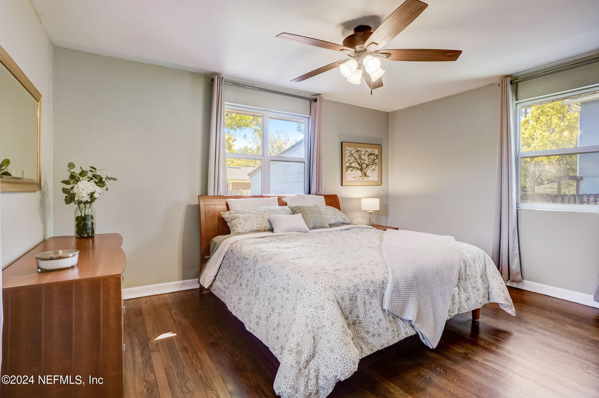 1435 Monticello Road Jacksonville, FL 32207 - Photo 23 of 33 a large bed sitting in a bedroom next to a window