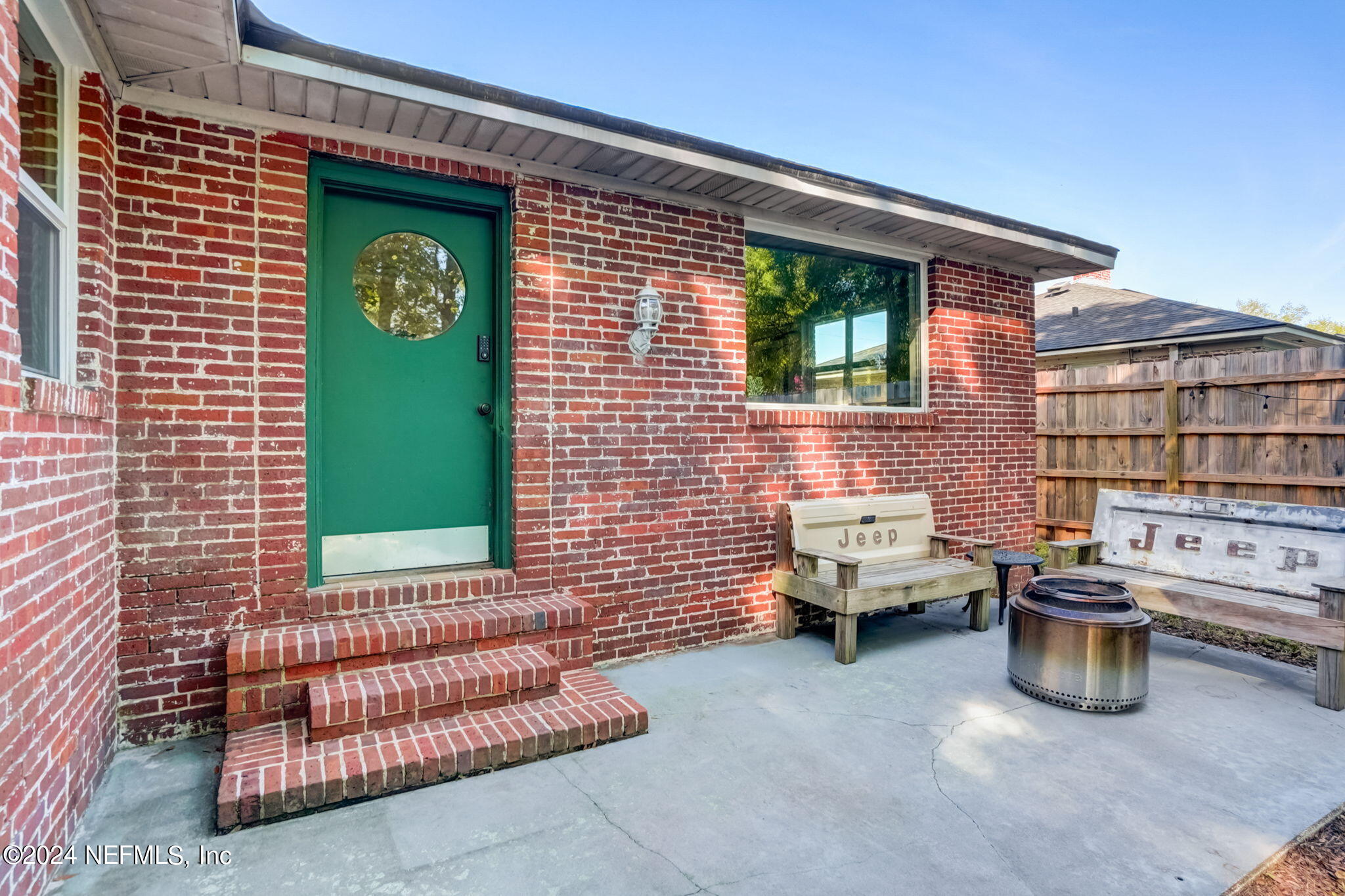 1435 Monticello Road Jacksonville, FL 32207 - Photo 25 of 33 a brick building with a bench in front of it