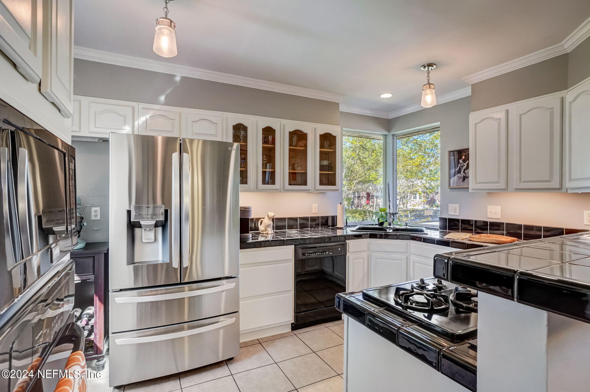 1435 Monticello Road Jacksonville, FL 32207 - Photo 9 of 33 a kitchen with a refrigerator stove and sink