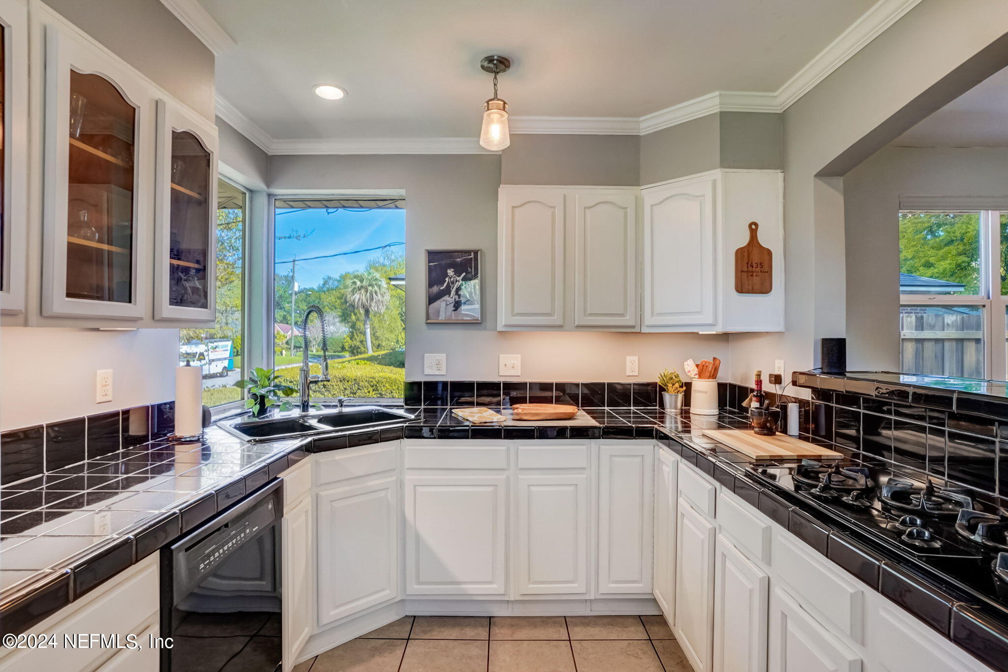 1435 Monticello Road Jacksonville, FL 32207 - Photo 10 of 33 a kitchen with a sink stove top oven and cabinets