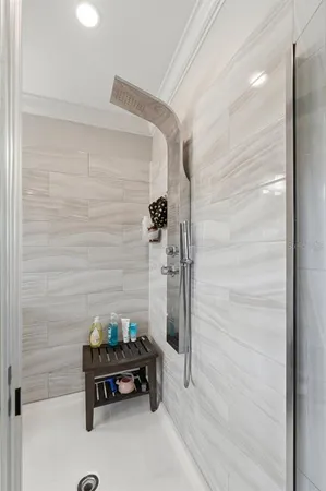 a bathroom with a double vanity sink a mirror and a bathtub