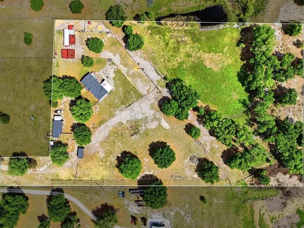 an aerial view of residential house with outdoor space