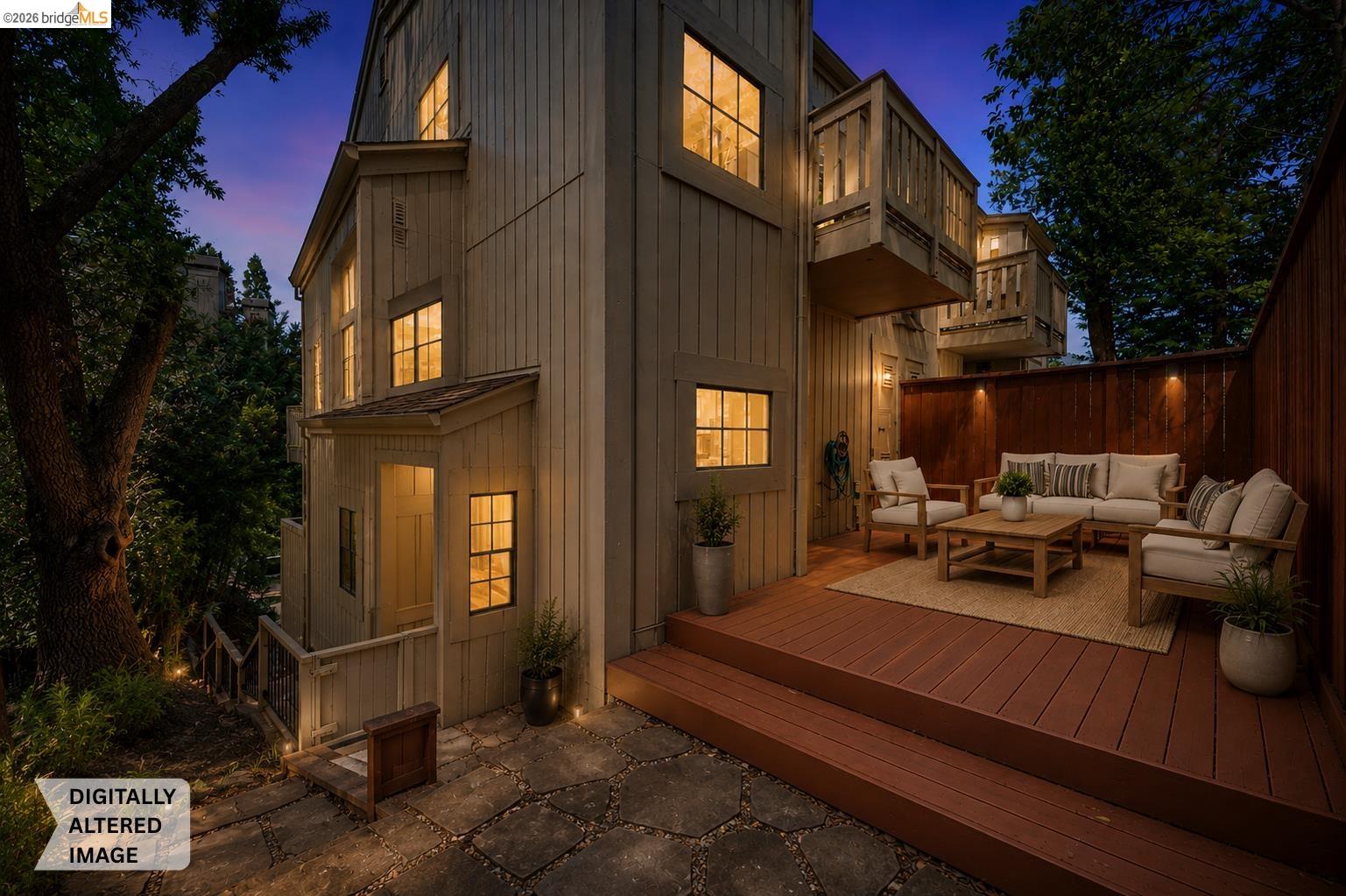 261 Redhawk Road Novato, CA 94949 - Photo 42 of 47 Multi-story exterior with vertical siding and multiple windows, featuring a private ground-level patio with steps leading to an elevated deck
