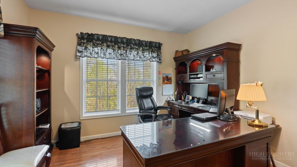 713 Kalmia Lane Boone, NC 28607 - Photo 12 of 50 a view of a workspace with furniture and a window