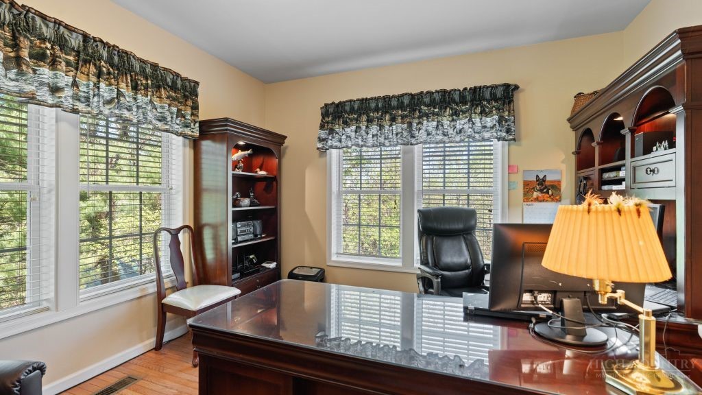 713 Kalmia Lane Boone, NC 28607 - Photo 13 of 50 a living room with furniture and a flat screen tv
