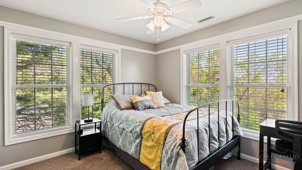 713 Kalmia Lane Boone, NC 28607 - Photo 14 of 50 a bedroom with a bed and a window