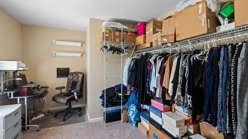 713 Kalmia Lane Boone, NC 28607 - Photo 18 of 50 a view of walk in closet with clothes