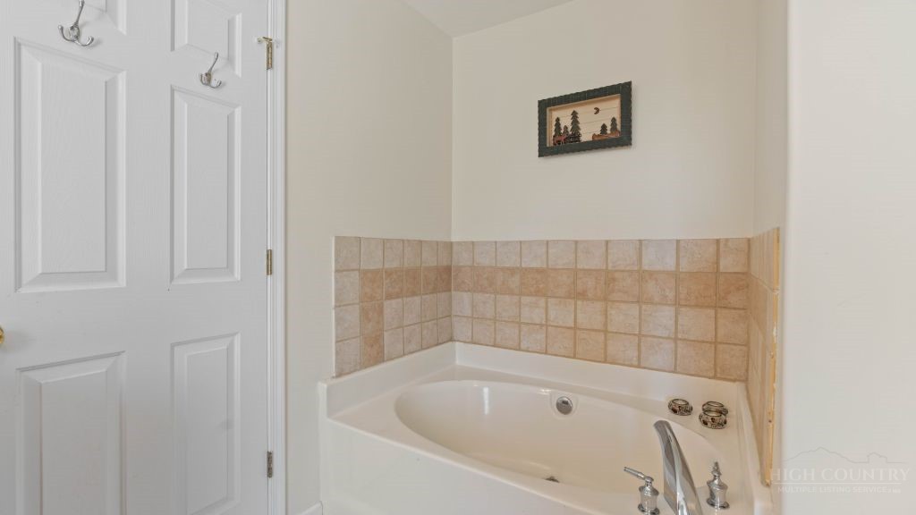 713 Kalmia Lane Boone, NC 28607 - Photo 21 of 50 a bathroom with a bathtub