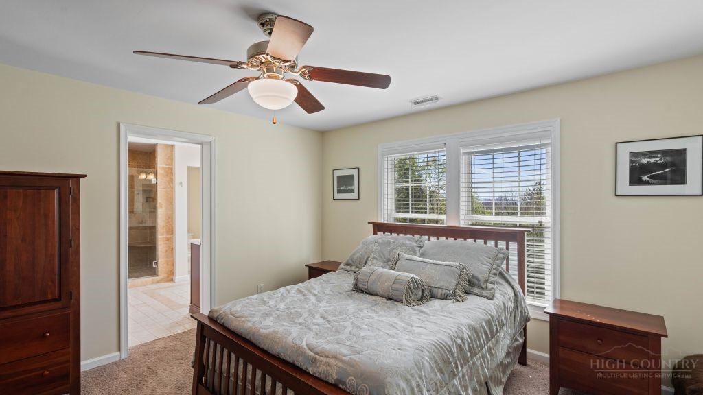 713 Kalmia Lane Boone, NC 28607 - Photo 24 of 50 a bedroom with a bed and a window