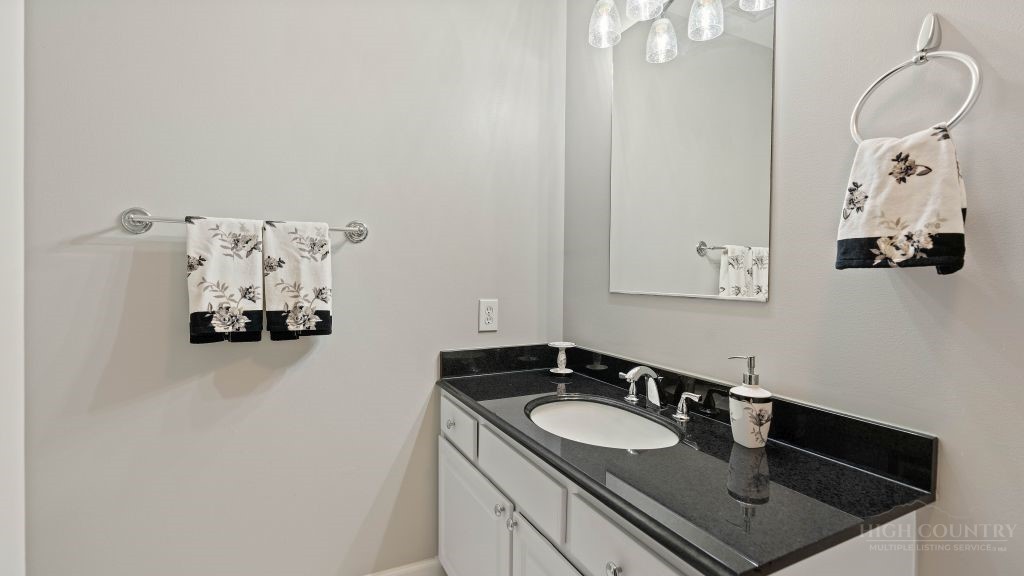 713 Kalmia Lane Boone, NC 28607 - Photo 27 of 50 a bathroom with a sink and mirror