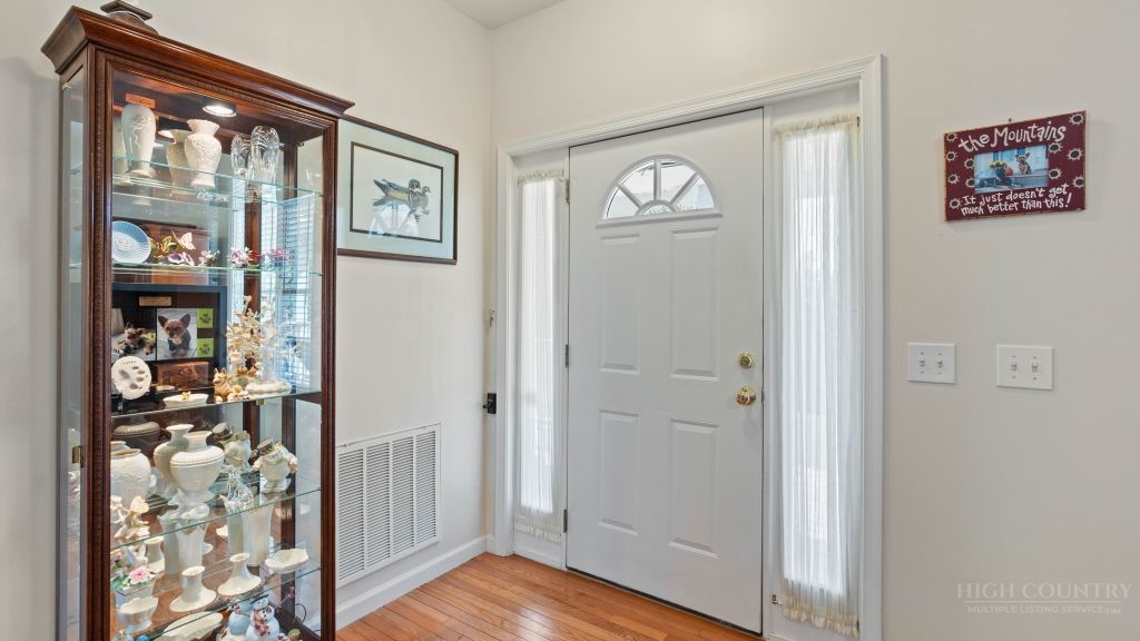 713 Kalmia Lane Boone, NC 28607 - Photo 28 of 50 a view of a hallway with wooden floor and entryway