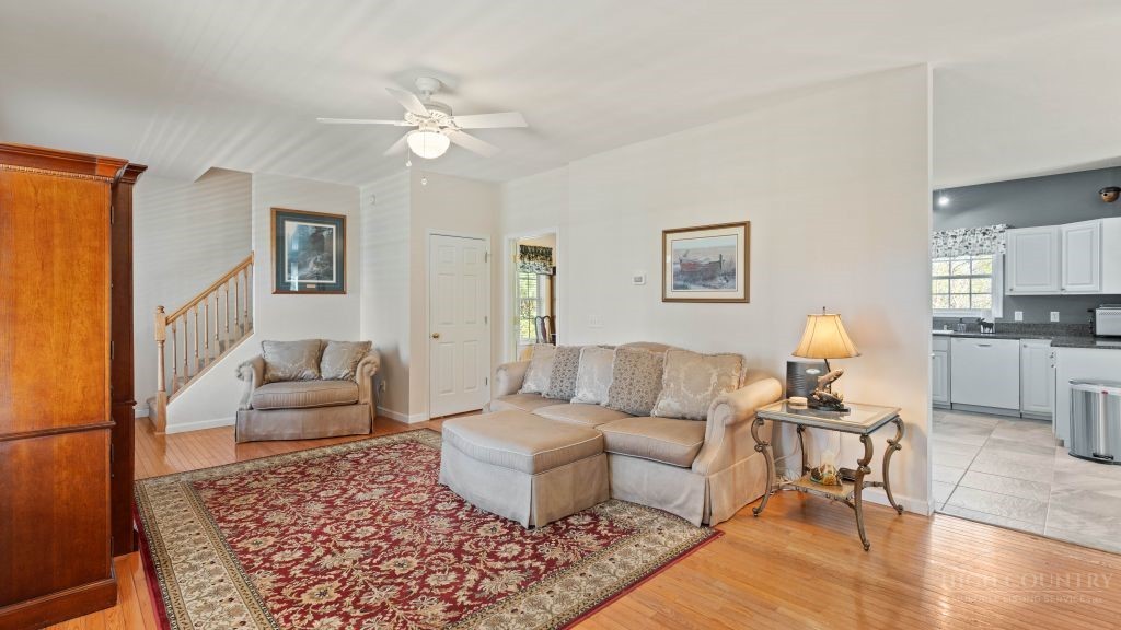 713 Kalmia Lane Boone, NC 28607 - Photo 30 of 50 a living room with furniture and wooden floor