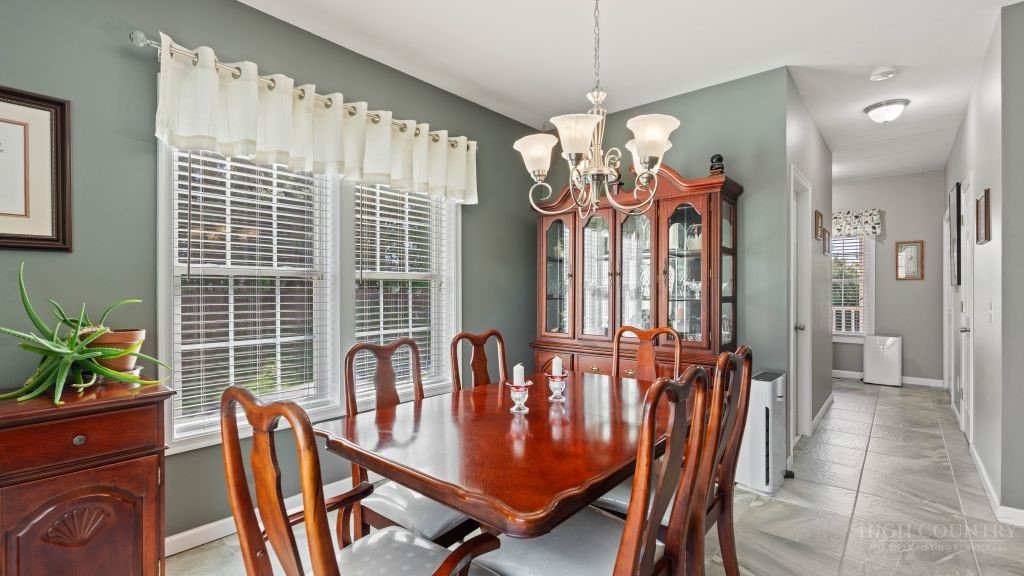 713 Kalmia Lane Boone, NC 28607 - Photo 7 of 50 a view of a dining room with furniture window and wooden floor