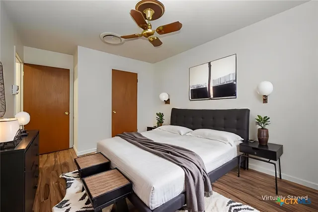 a bedroom with a bed and a desk