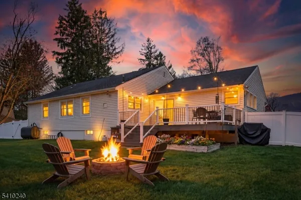 a view of a backyard with sitting area