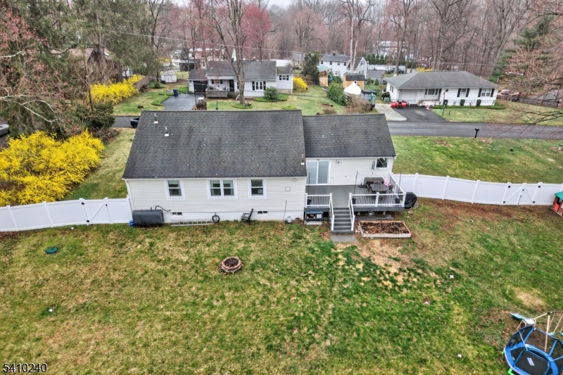 5 Birch Road Andover, NJ 07821 - Photo 14 of 41 a aerial view of a house with swimming pool and large trees