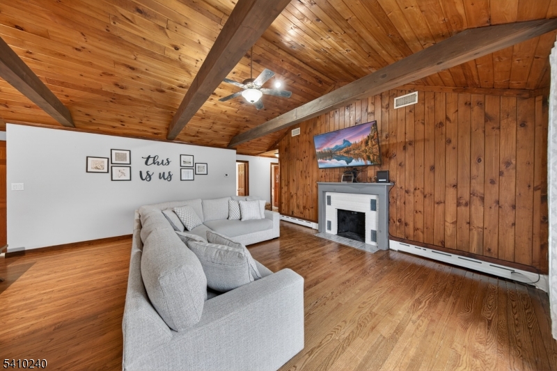 5 Birch Road Andover, NJ 07821 - Photo 18 of 41 a view of a livingroom with furniture wooden floor fire place and windows