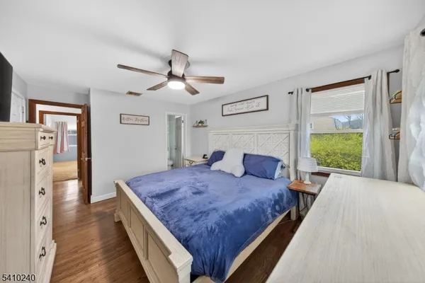 a room with stainless steel appliances granite countertop a stove a sink dishwasher and cabinets