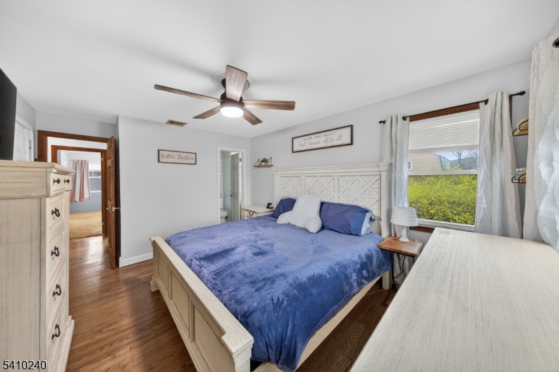 5 Birch Road Andover, NJ 07821 - Photo 25 of 41 a living room with a bed furniture and a fireplace