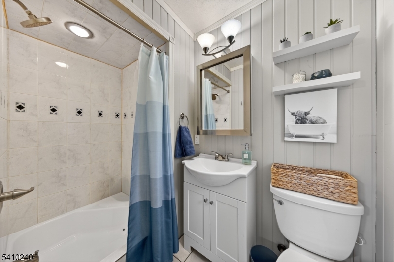 5 Birch Road Andover, NJ 07821 - Photo 26 of 41 a bathroom with a granite countertop sink a toilet and shower