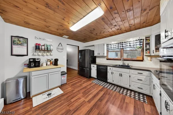 a view of a livingroom with furniture and wooden floor