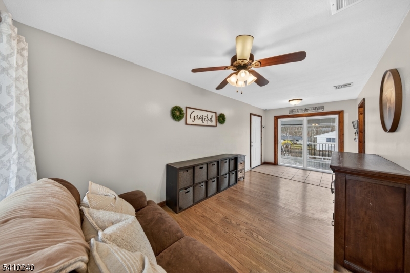 5 Birch Road Andover, NJ 07821 - Photo 31 of 41 a bedroom with a bed and wooden floor