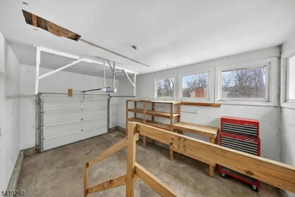 a view of empty room with wooden ceiling