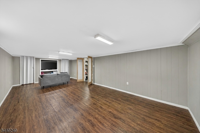 5 Birch Road Andover, NJ 07821 - Photo 39 of 41 a living room with hard wood floors and a wooden floor