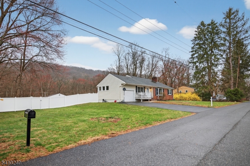 5 Birch Road Andover, NJ 07821 - Photo 5 of 41 a front view of a house with a yard and garage