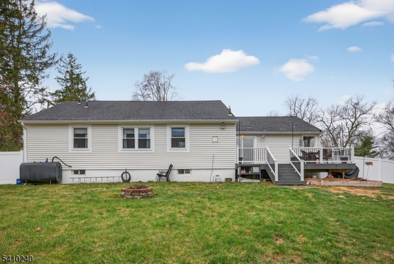 5 Birch Road Andover, NJ 07821 - Photo 9 of 41 a front view of a house with a garden and chairs