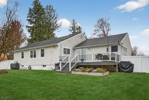 a front view of house with yard and outdoor seating