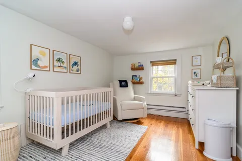 a bedroom with furniture and a window